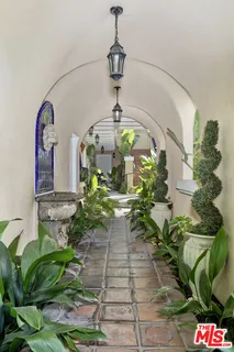 a vase of flowers sitting on a floor