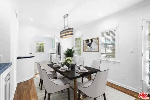 a view of a dining room with furniture and window