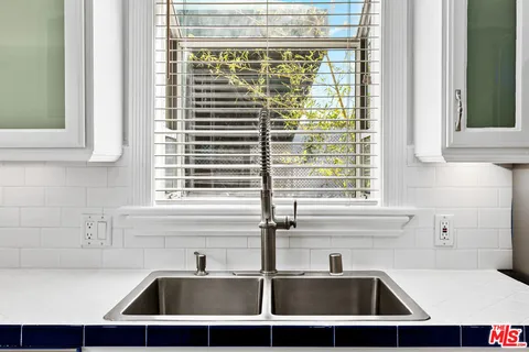 a view of a sink and a window