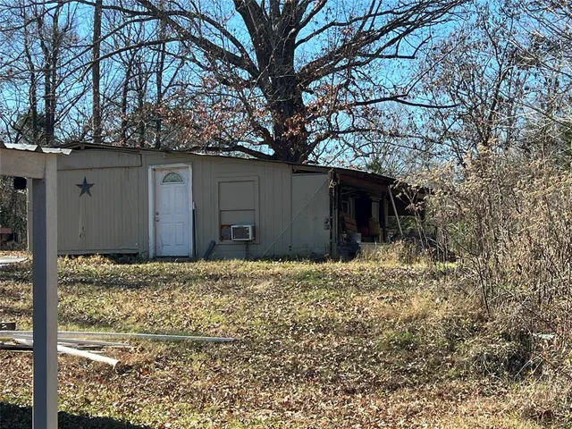 a house with a tree in front of it