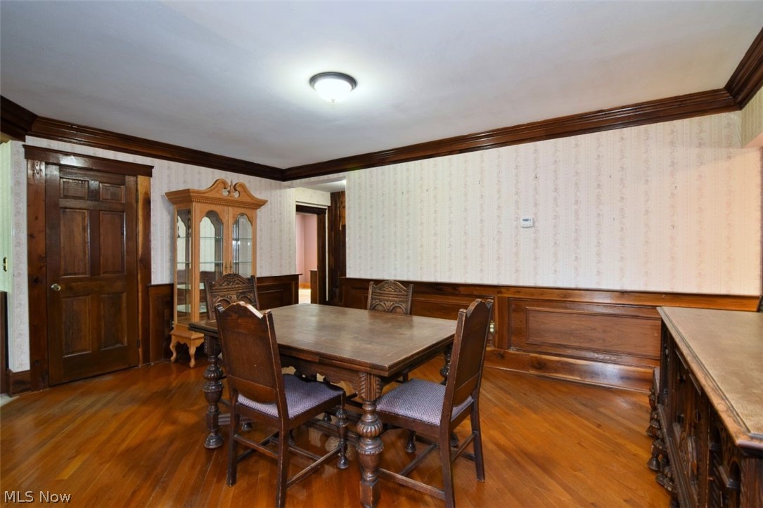 7251 Ryan Road Medina, OH 44256 - Photo 3 of 47 Hardwood flooring complemented by handcrafted walnut wainscoting and crown molding