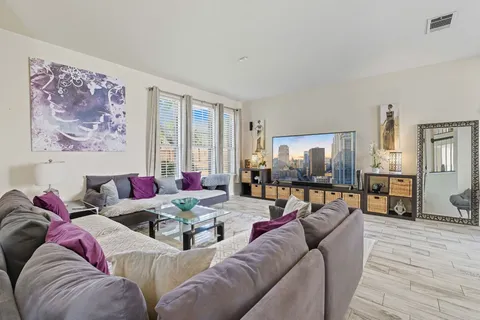 a living room with furniture and a large window