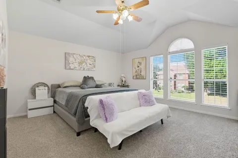 a bathroom with a tub sink toilet and a mirror