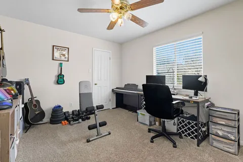 a view of a backyard with swimming pool