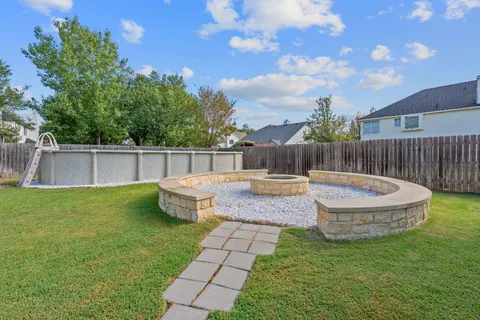 a view of a swimming pool with a patio