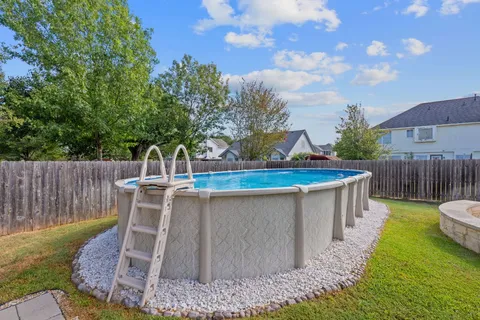 a view of a chair and table on the patio