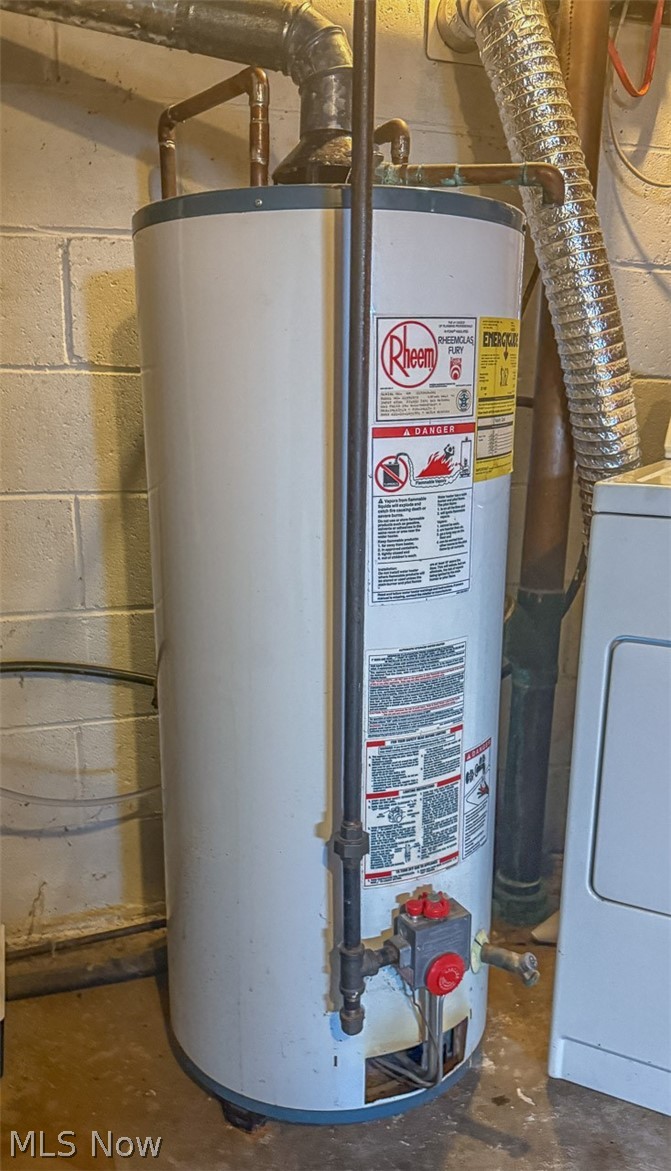 3336 Broad Run Dairy Road Northwest Dover, OH 44622 - Photo 24 of 26 Utilities featuring water heater and washer / clothes dryer