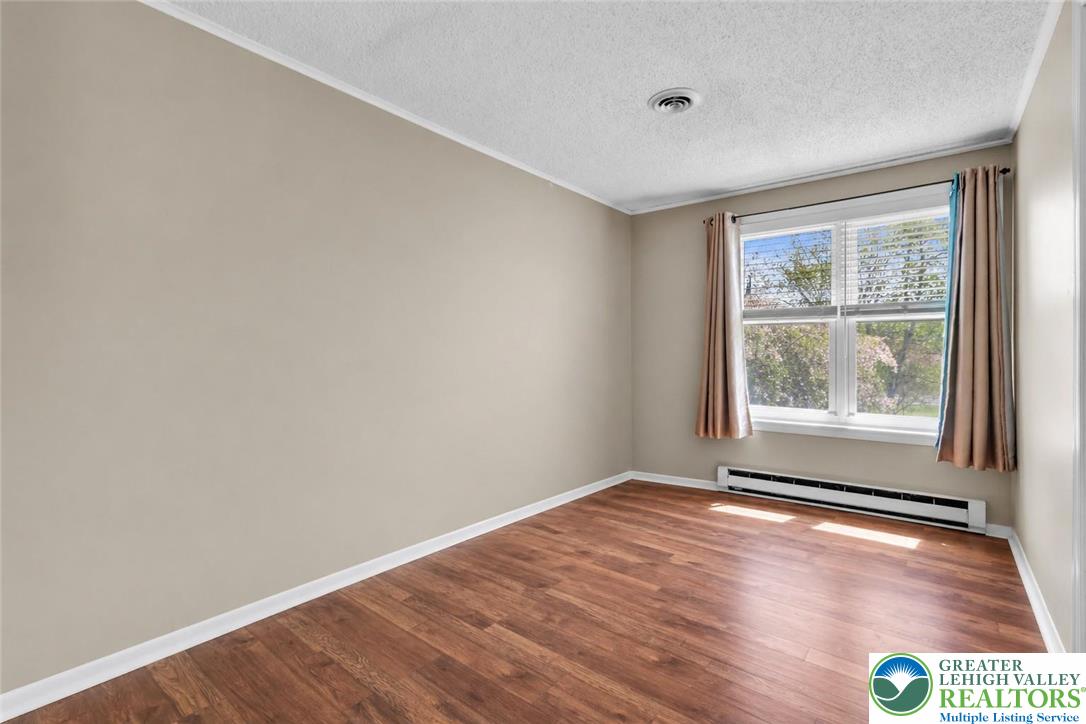 4263 Park Avenue Slatington, PA 18080 - Photo 29 of 54 a view of an empty room with wooden floor and a window