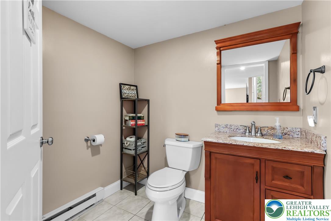 4263 Park Avenue Slatington, PA 18080 - Photo 43 of 54 a bathroom with a toilet sink and mirror