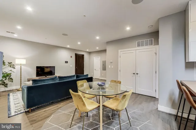 a kitchen with a dining table and chairs