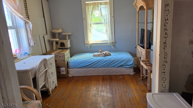 1115 West Camplain Road Manville, NJ 08835 - Photo 17 of 18 a bedroom with furniture and a window