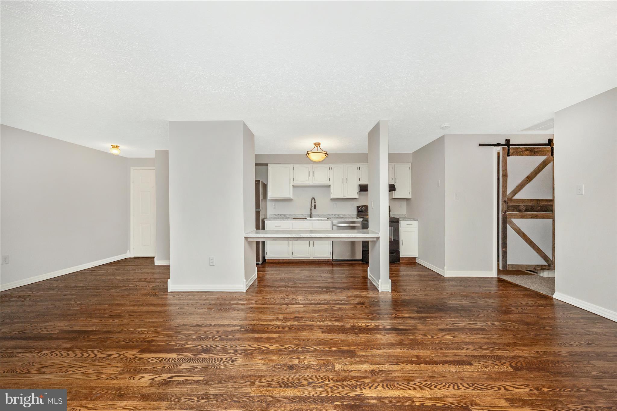 550 Heather Ridge Drive, Unit K Frederick, MD 21702 - Photo 12 of 45 a view of a kitchen with wooden floor