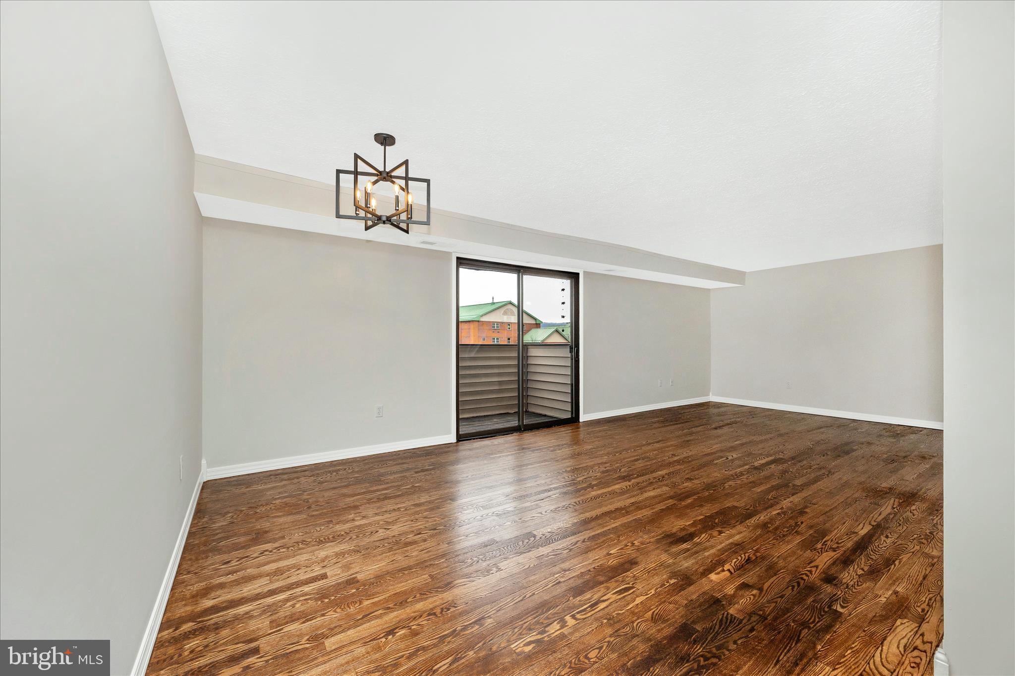 550 Heather Ridge Drive, Unit K Frederick, MD 21702 - Photo 13 of 45 a view of a room with wooden floor and window