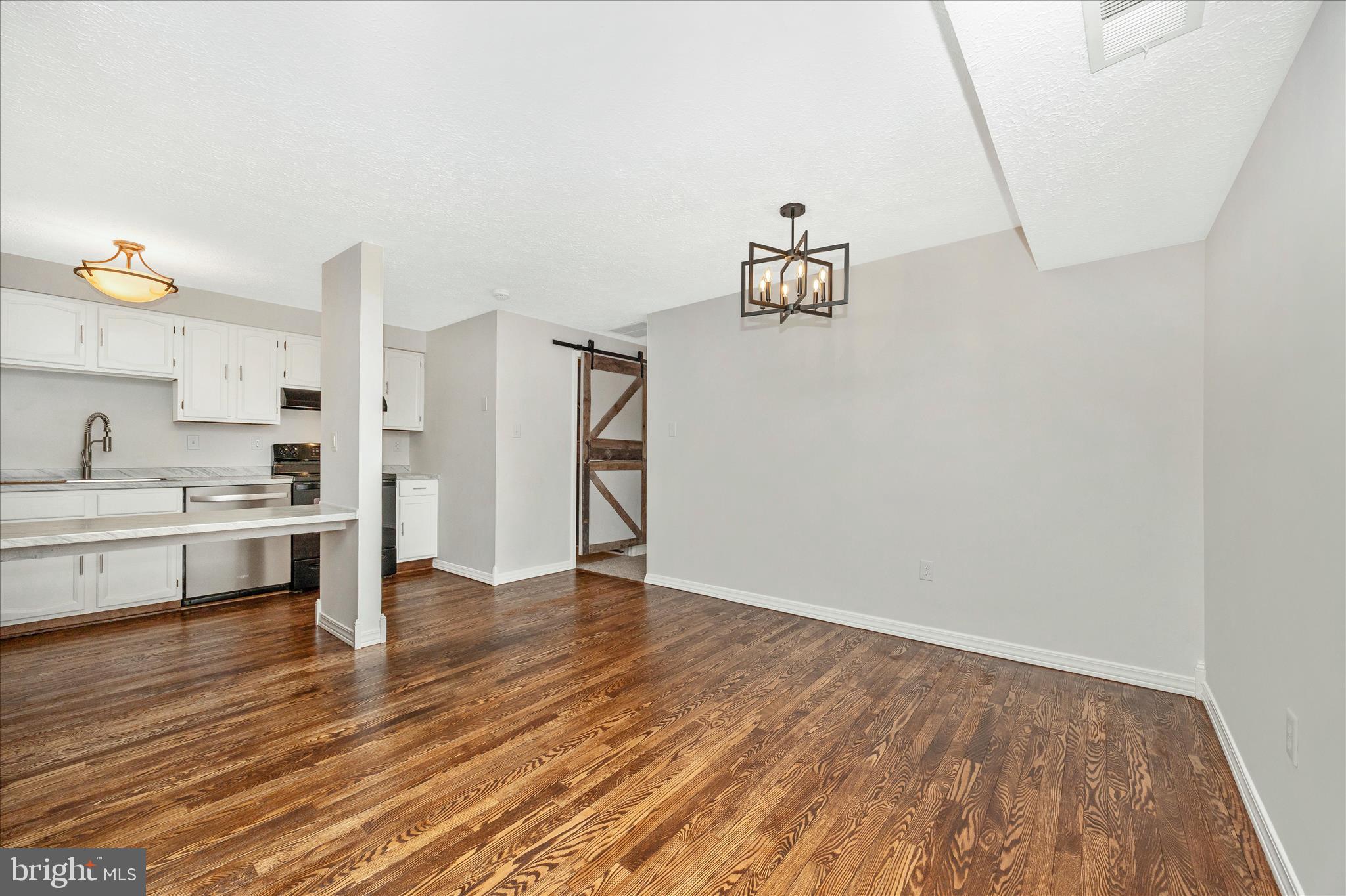 550 Heather Ridge Drive, Unit K Frederick, MD 21702 - Photo 15 of 45 a view of a kitchen with wooden floor and electronic appliances