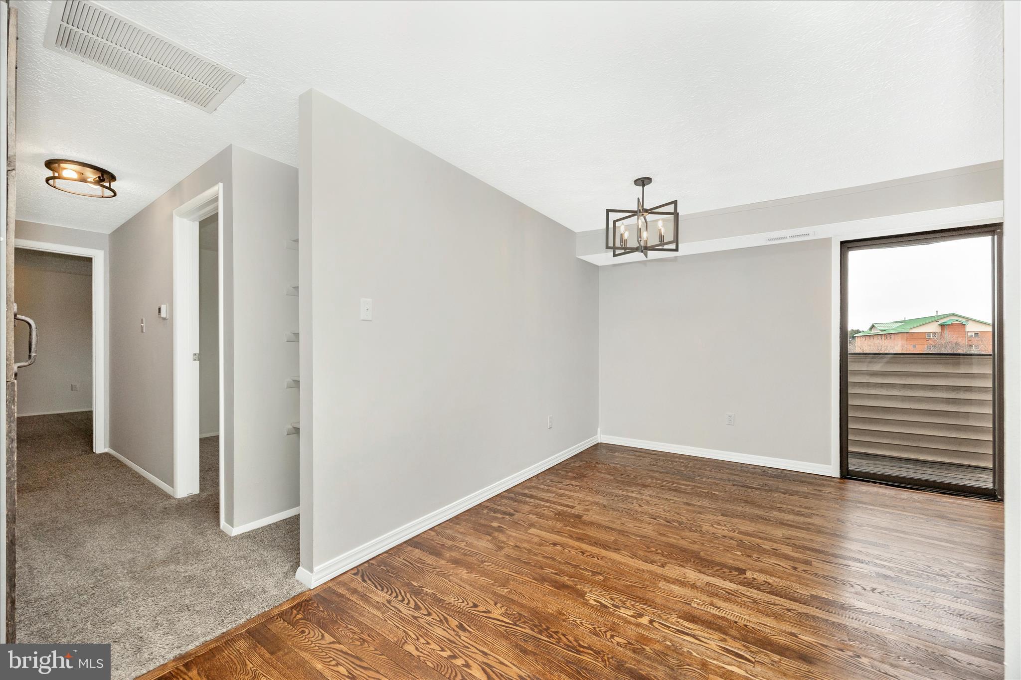 550 Heather Ridge Drive, Unit K Frederick, MD 21702 - Photo 16 of 45 a view of a room with wooden floor and white walls