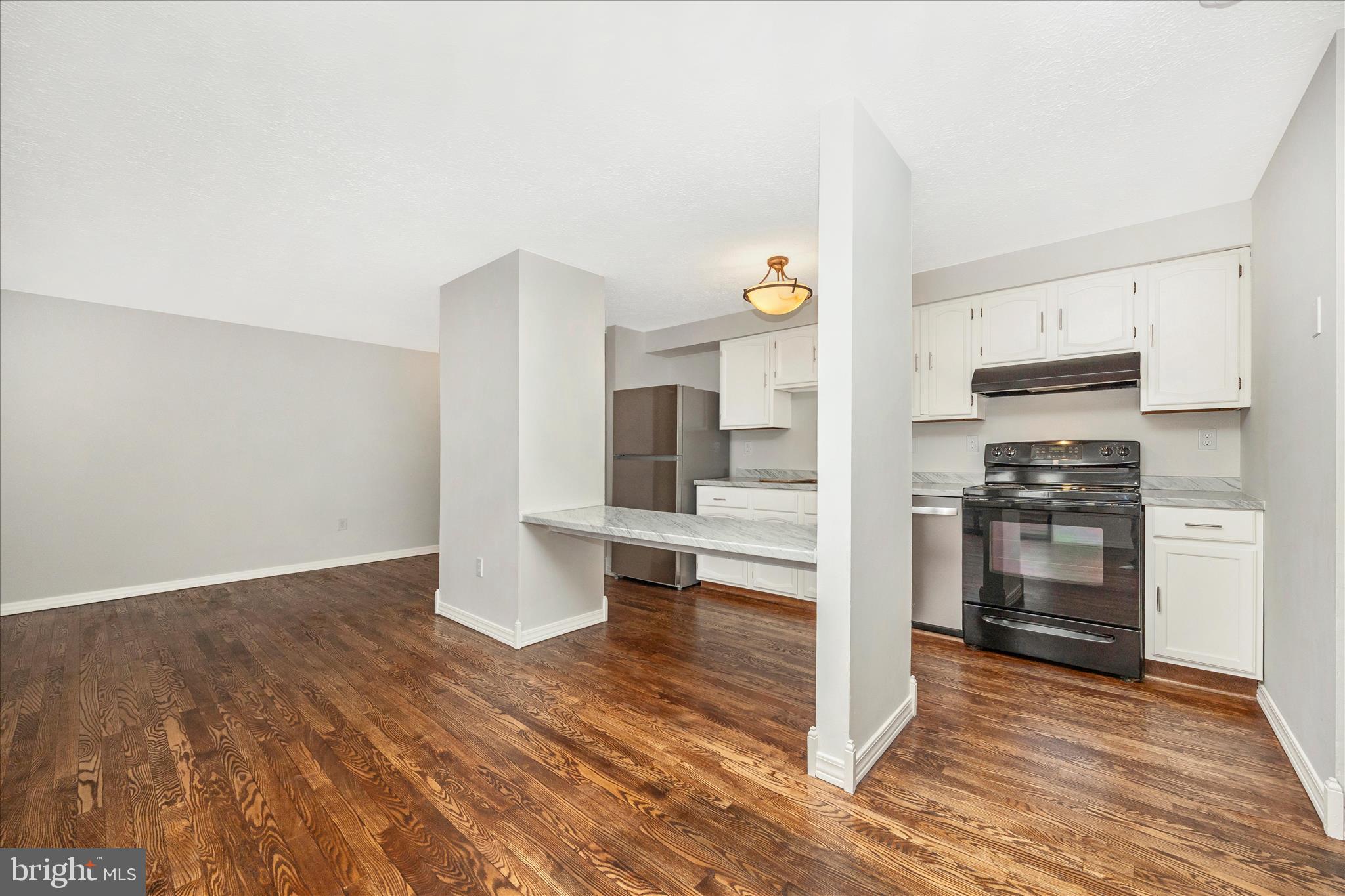 550 Heather Ridge Drive, Unit K Frederick, MD 21702 - Photo 17 of 45 a view of kitchen and wooden floor