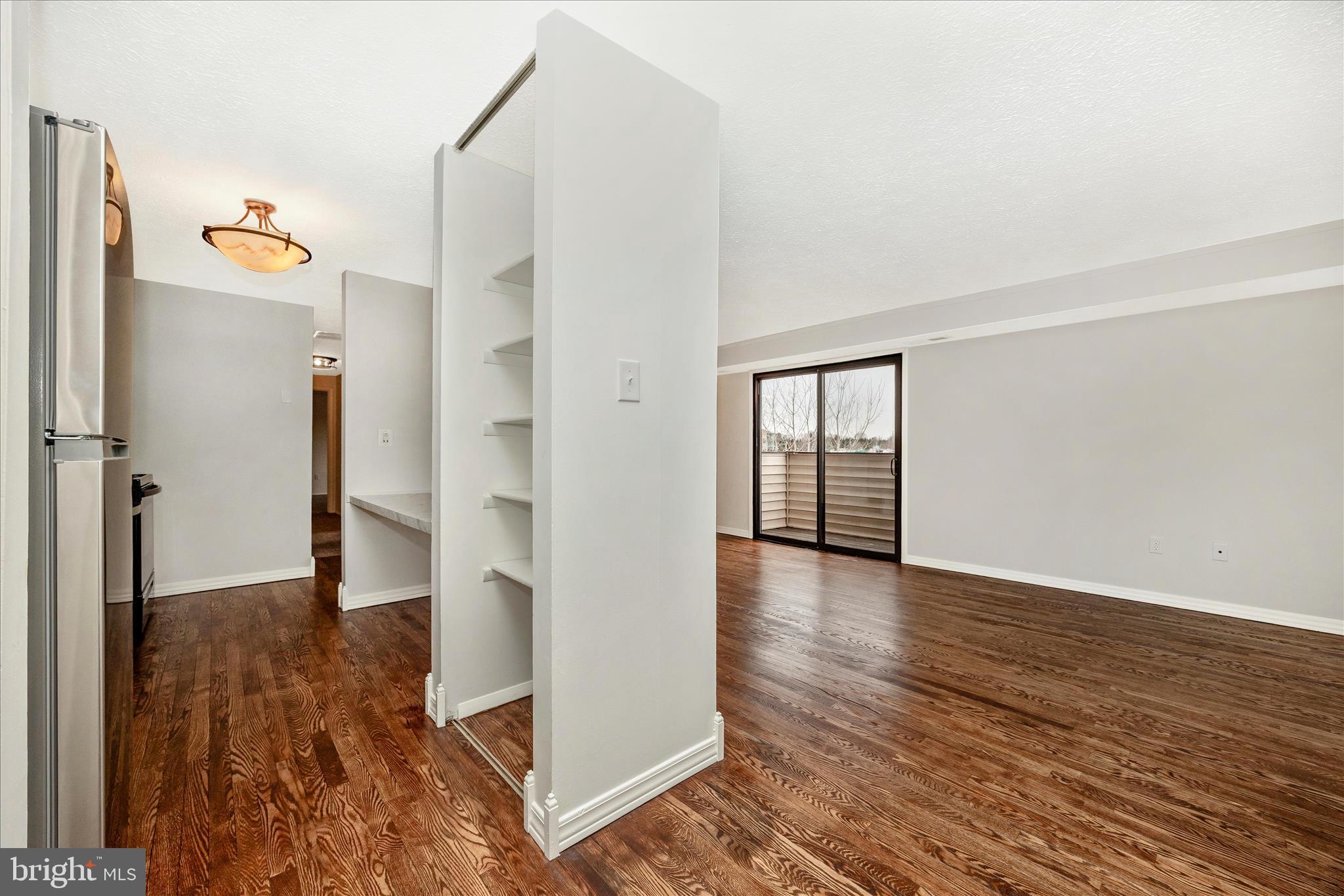 550 Heather Ridge Drive, Unit K Frederick, MD 21702 - Photo 18 of 45 wooden floor in an empty room