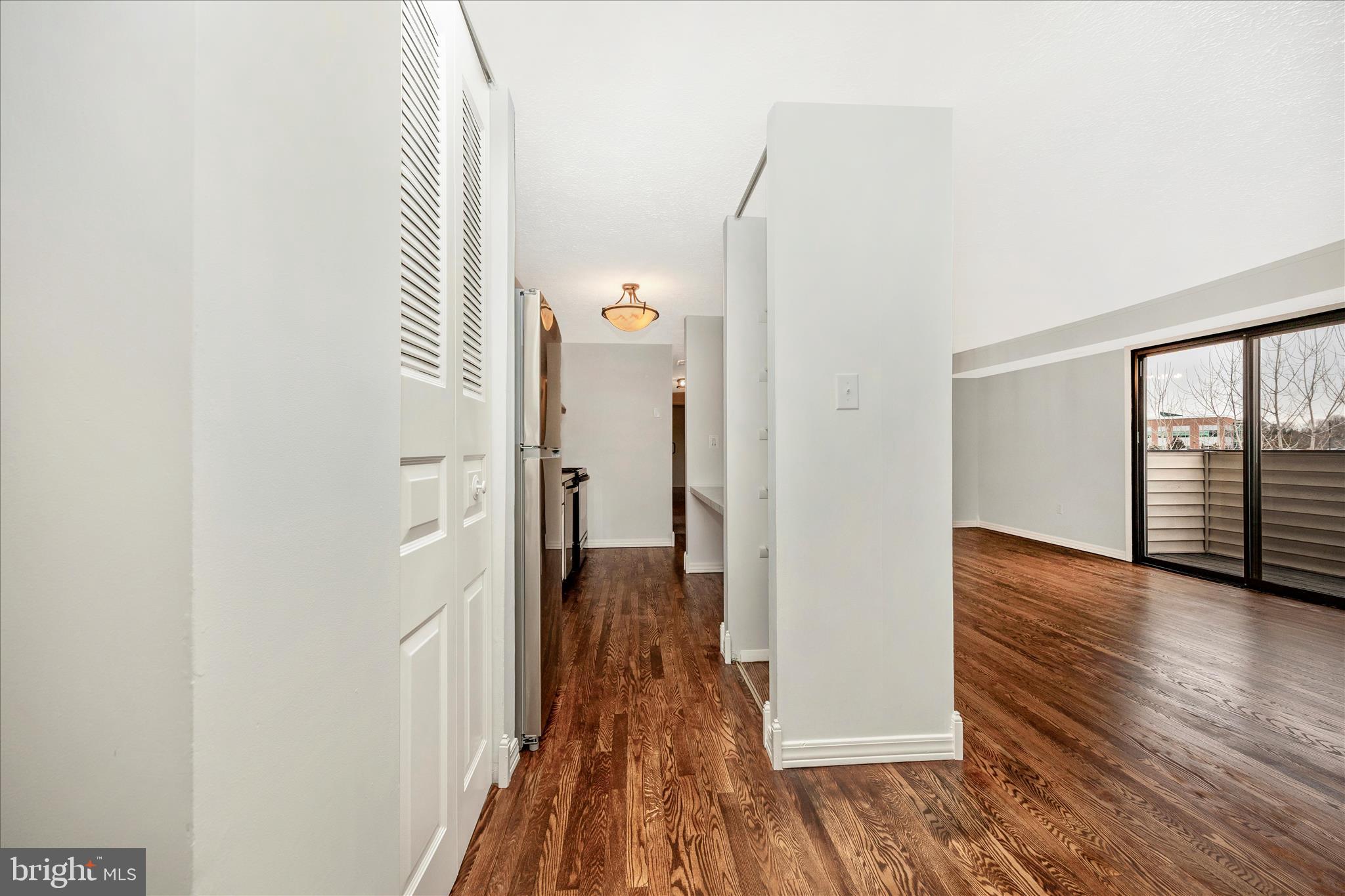 550 Heather Ridge Drive, Unit K Frederick, MD 21702 - Photo 20 of 45 a view of a hallway with wooden floor and staircase