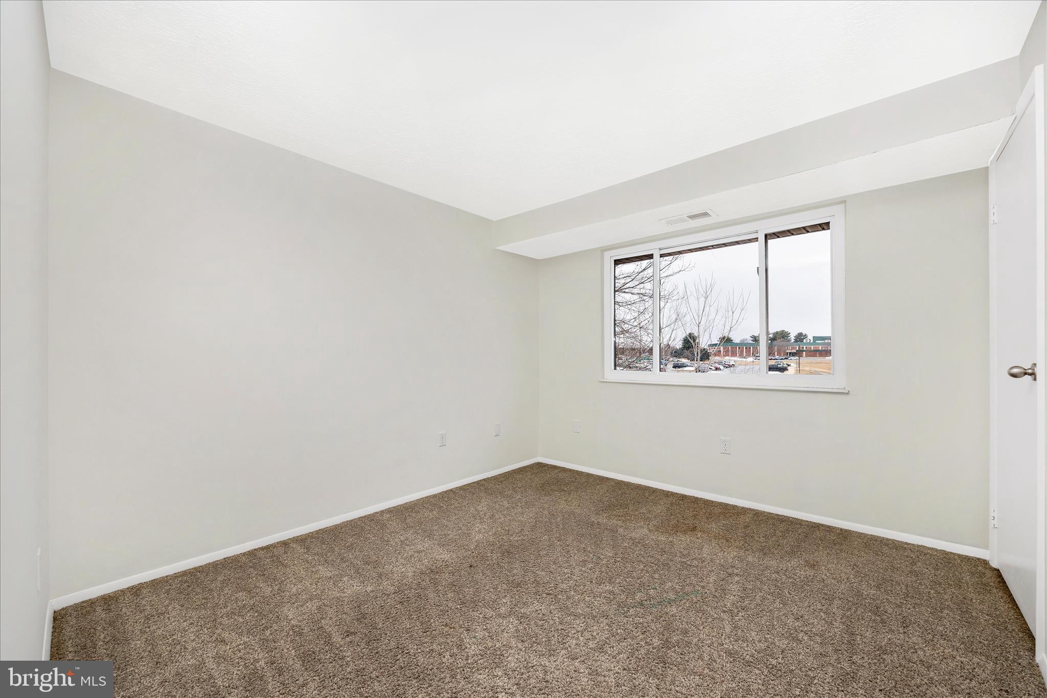 550 Heather Ridge Drive, Unit K Frederick, MD 21702 - Photo 27 of 45 an empty room with windows