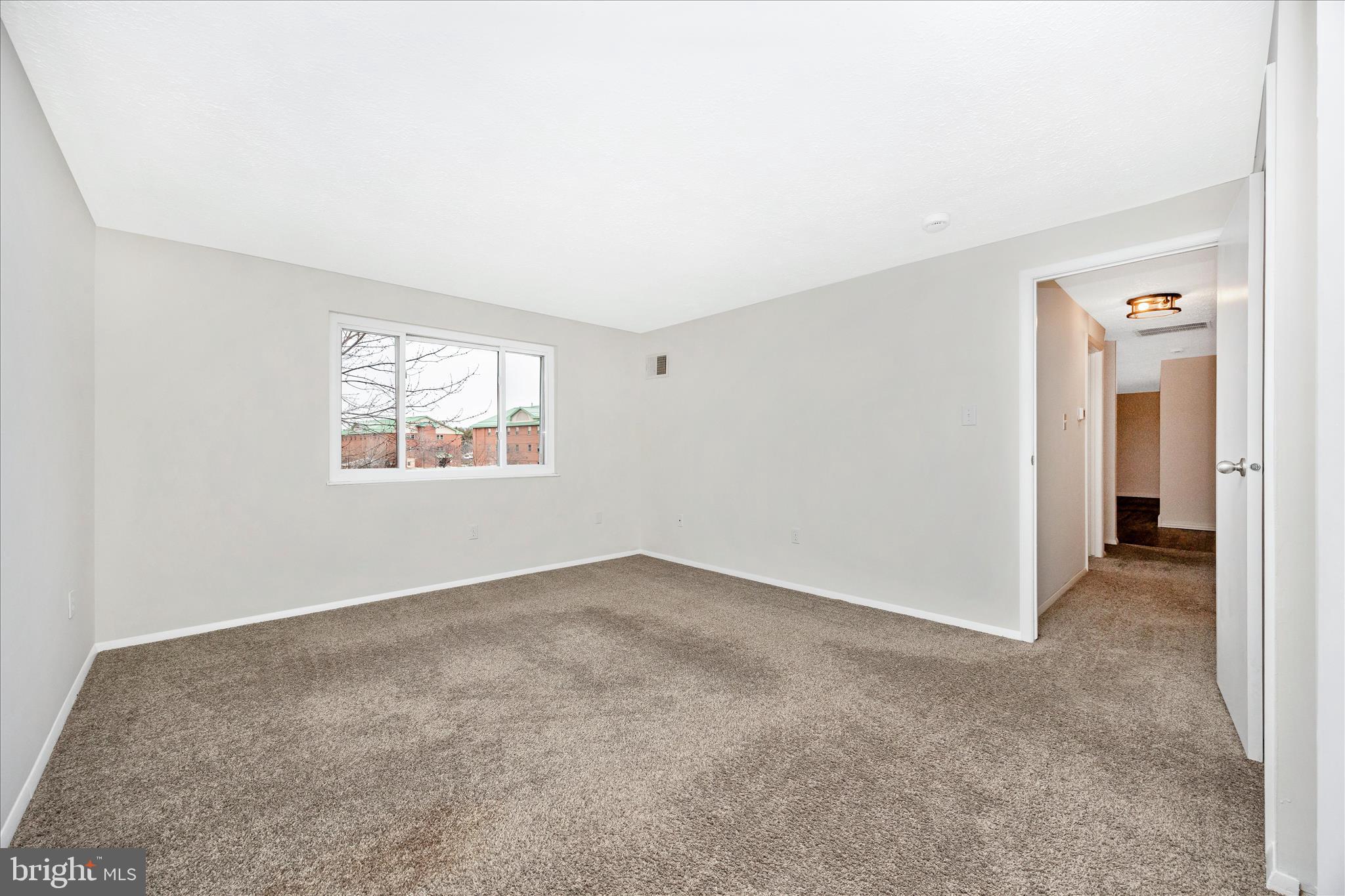 550 Heather Ridge Drive, Unit K Frederick, MD 21702 - Photo 29 of 45 an empty room with windows and closet