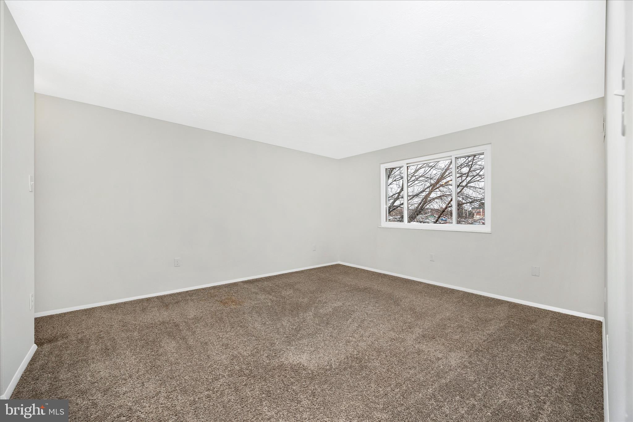 550 Heather Ridge Drive, Unit K Frederick, MD 21702 - Photo 30 of 45 an empty room with windows