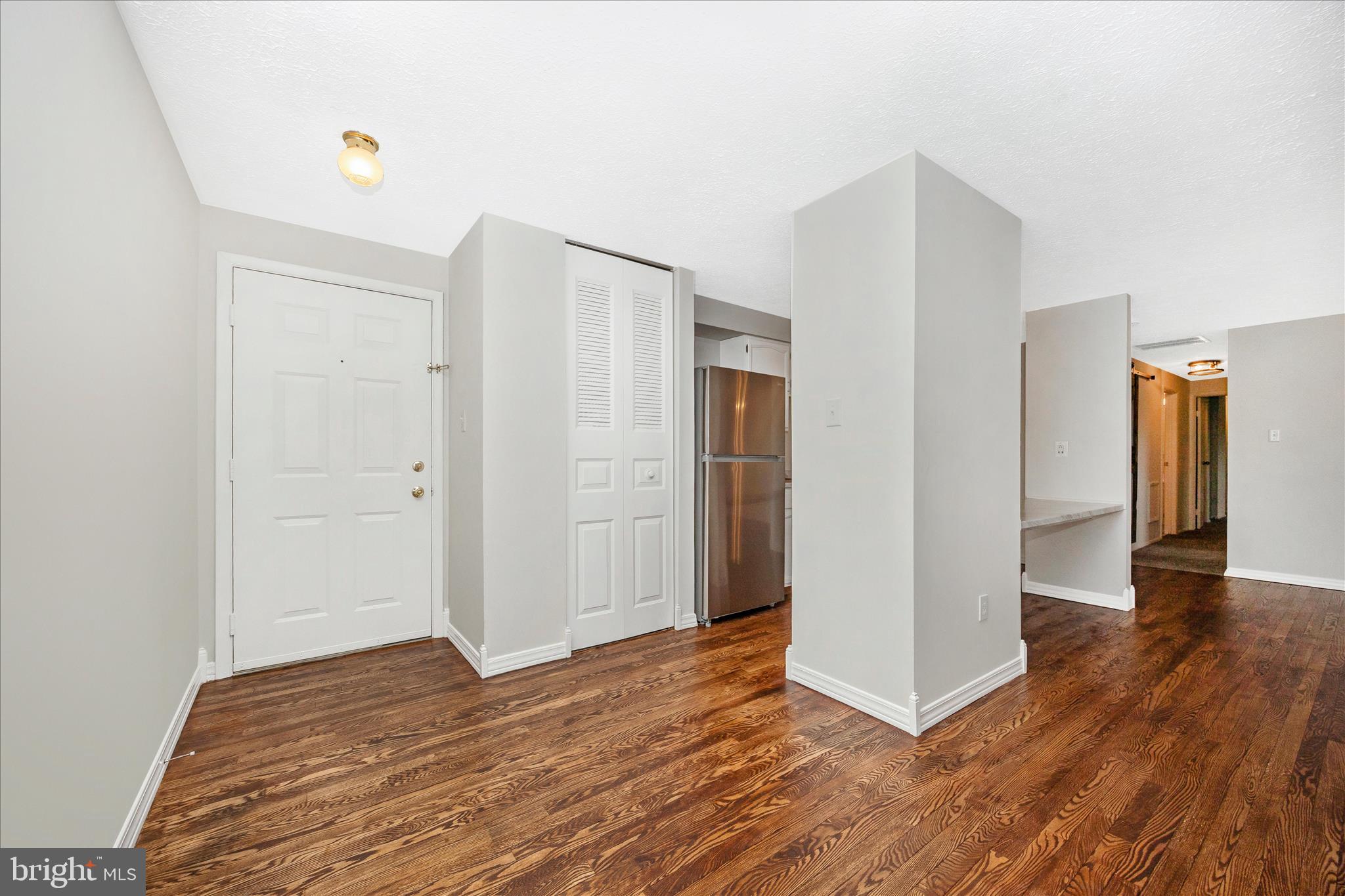 550 Heather Ridge Drive, Unit K Frederick, MD 21702 - Photo 4 of 45 a view of empty room with wooden floor