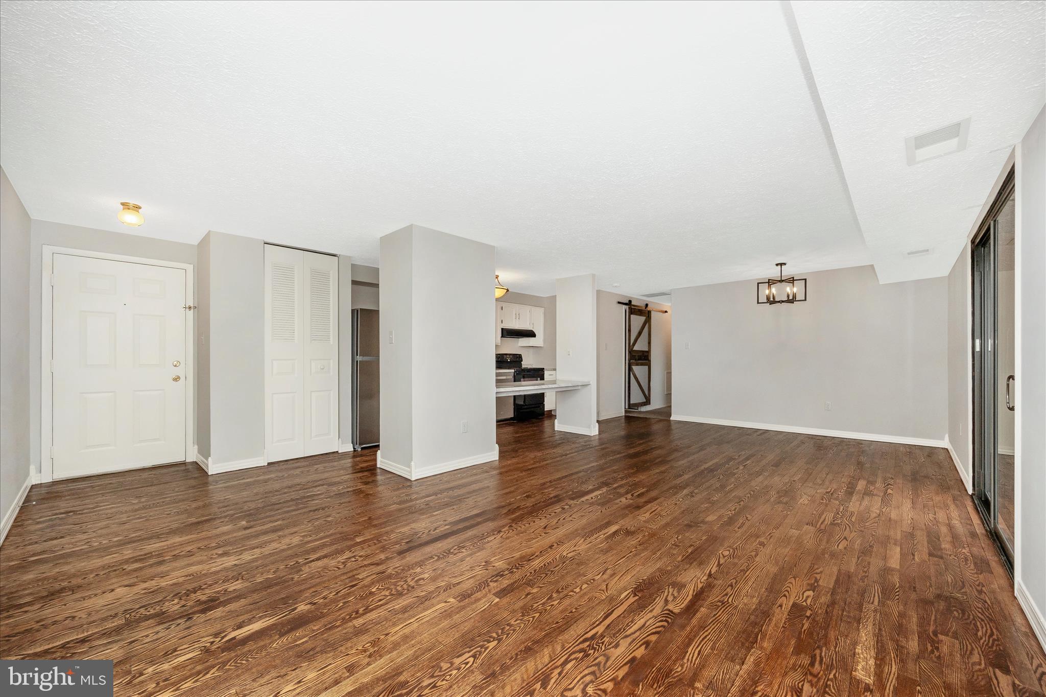 550 Heather Ridge Drive, Unit K Frederick, MD 21702 - Photo 7 of 45 a view of empty room with wooden floor