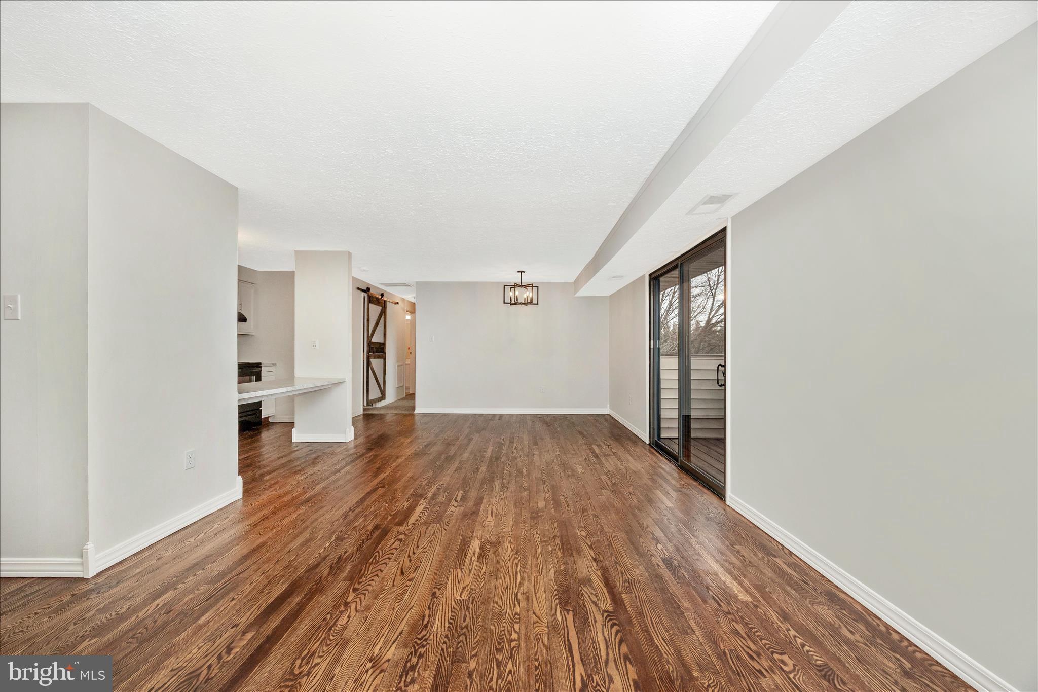 550 Heather Ridge Drive, Unit K Frederick, MD 21702 - Photo 8 of 45 a view of a room with wooden floor and stairs