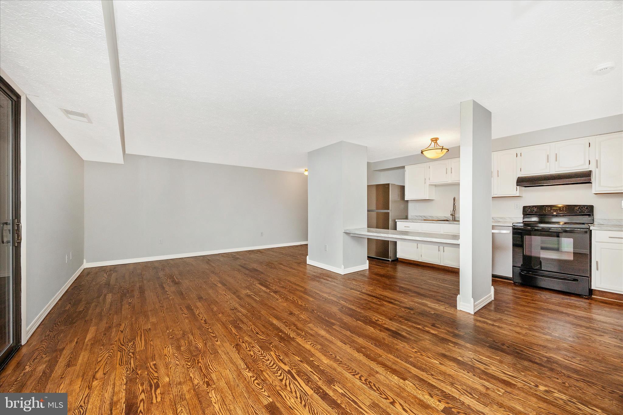 550 Heather Ridge Drive, Unit K Frederick, MD 21702 - Photo 10 of 45 a view of kitchen and wooden floor