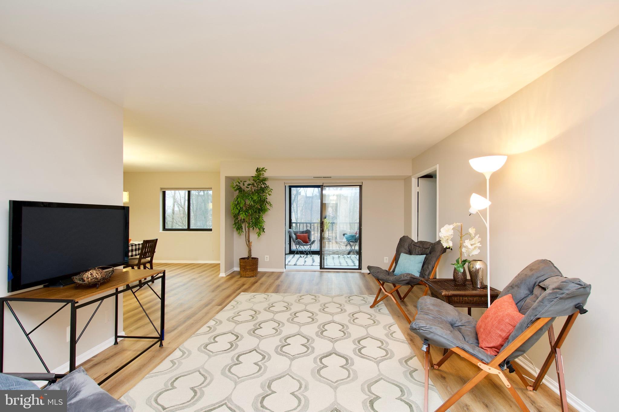 5902 Mt Eagle Drive, Unit 316 Alexandria, VA 22303 - Photo 1 of 46 Spacious living room; note the plank flooring