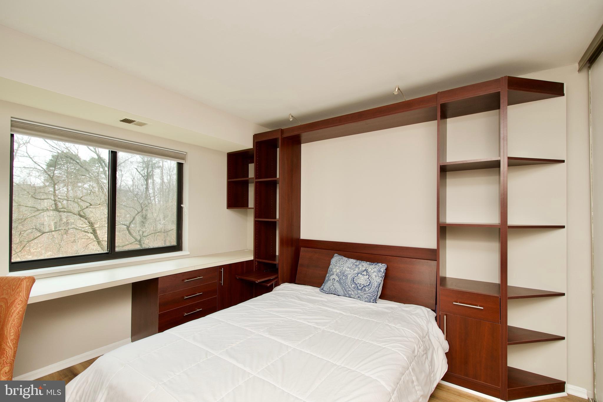 5902 Mt Eagle Drive, Unit 316 Alexandria, VA 22303 - Photo 10 of 46 Murphy bed has end tables and shelves