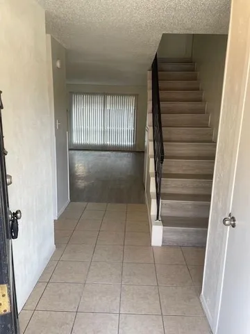 a view of entryway and hall with a window