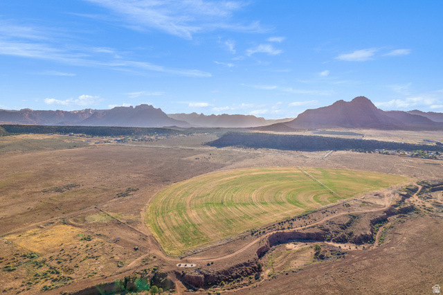 Gooseberry Way Apple Valley, UT 84737 - Photo 20 of 24 Expansive land featuring a large circular cultivated field, a smaller rectangular cultivated area, and a natural ravine
