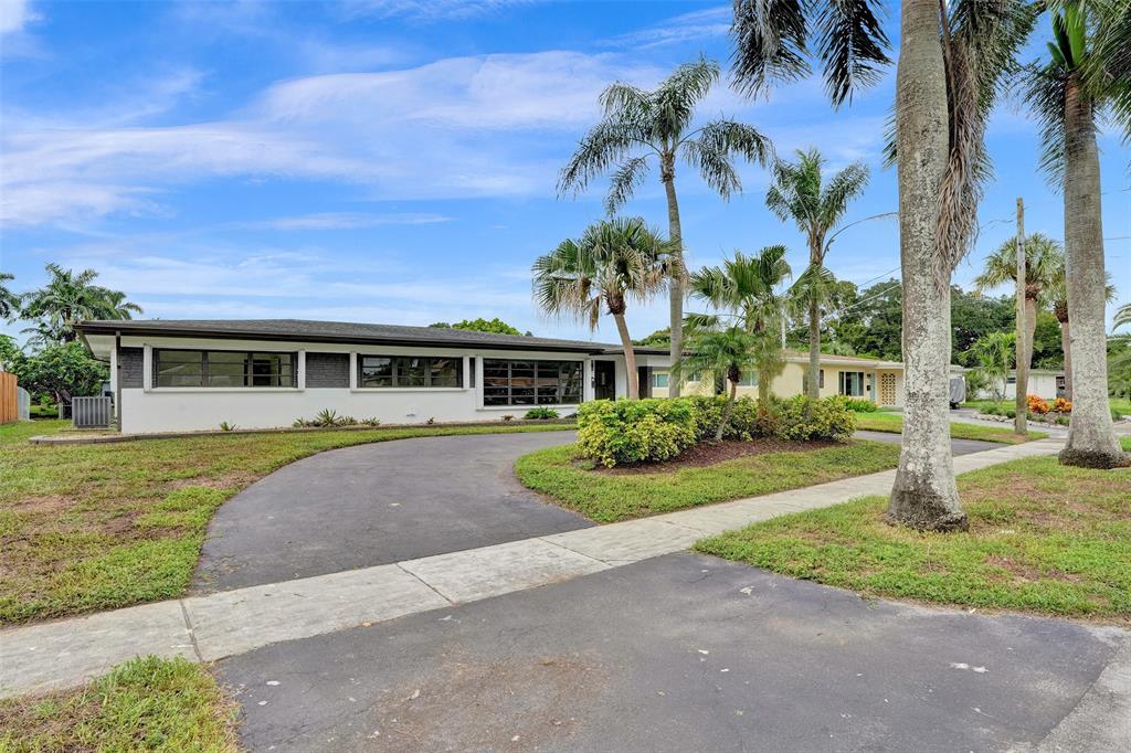 5840 Southwest 14th Street Plantation, FL 33317 - Photo 33 of 33 a front view of a house with a yard