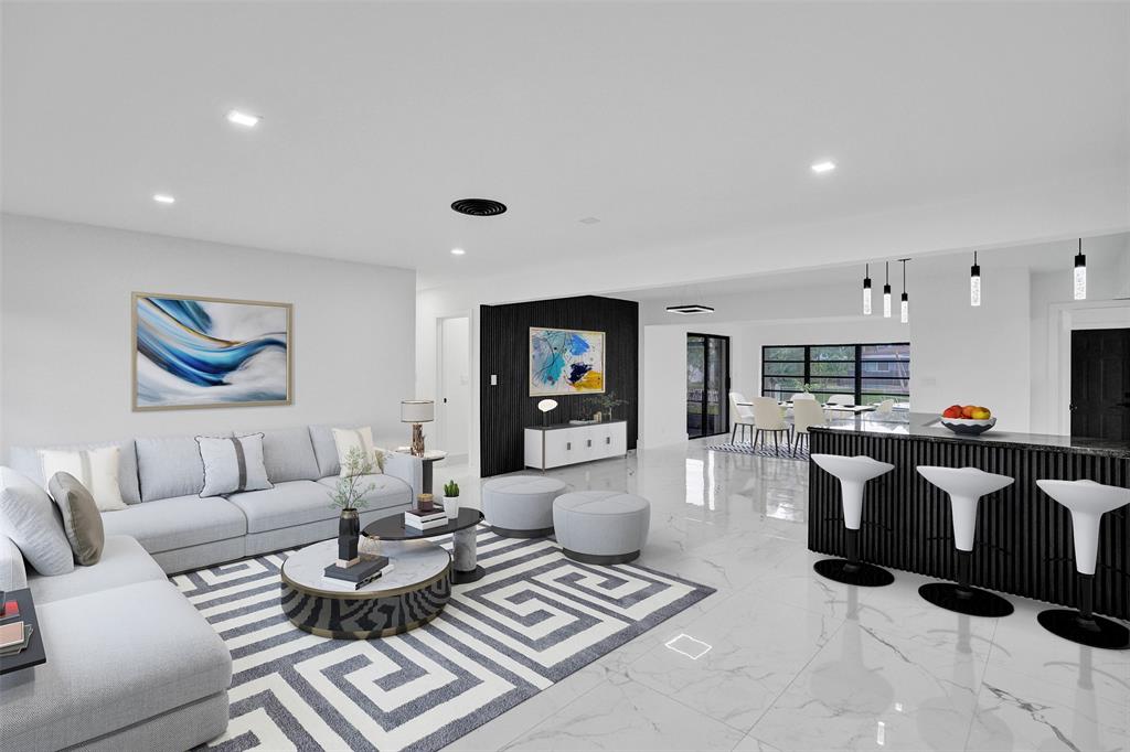 5840 Southwest 14th Street Plantation, FL 33317 - Photo 4 of 33 a living room with furniture and a wooden floor