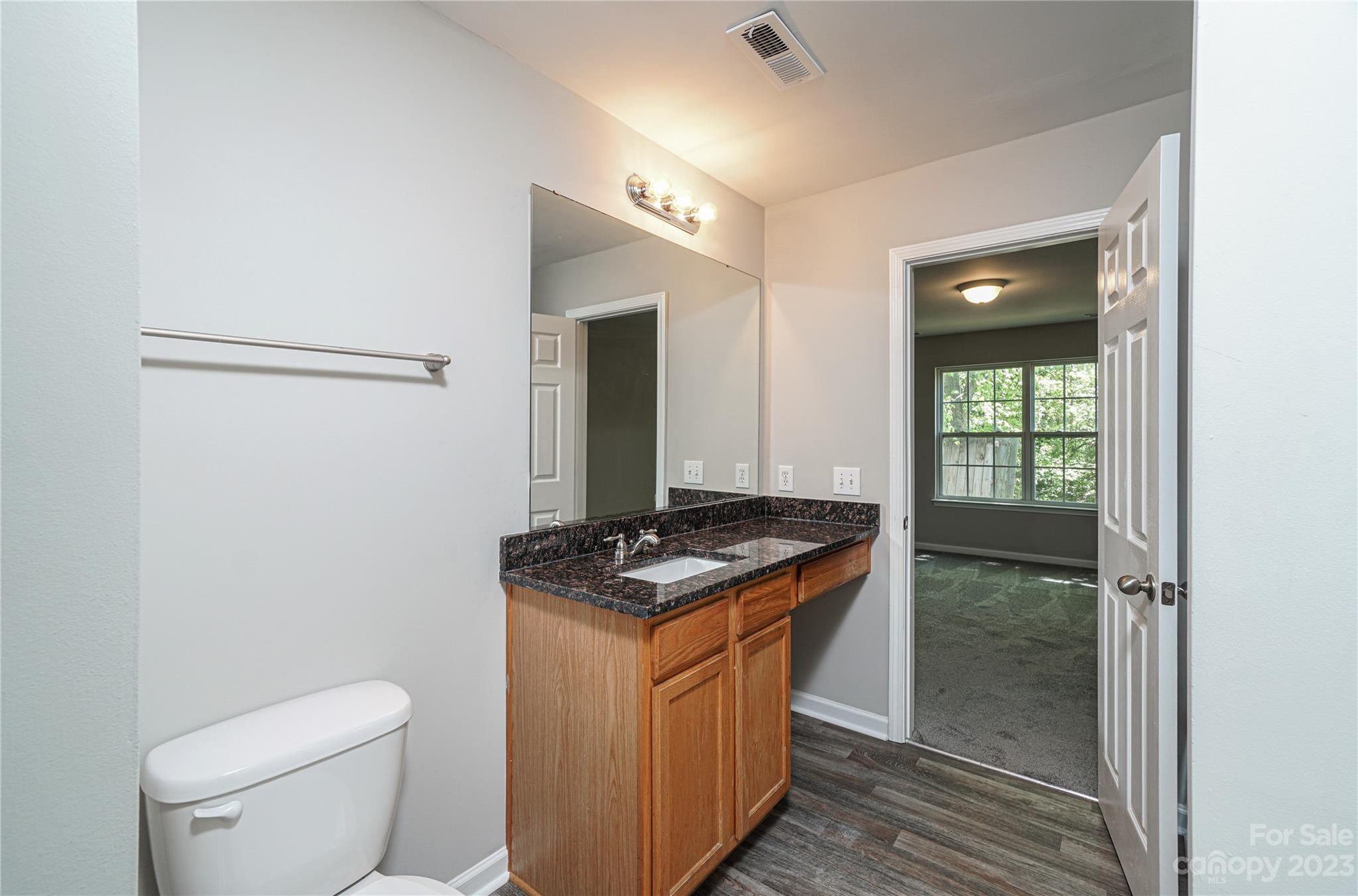 1312 Ben Livingston Road Charlotte, NC 28214 - Photo 12 of 12 a kitchen with a stove and a refrigerator