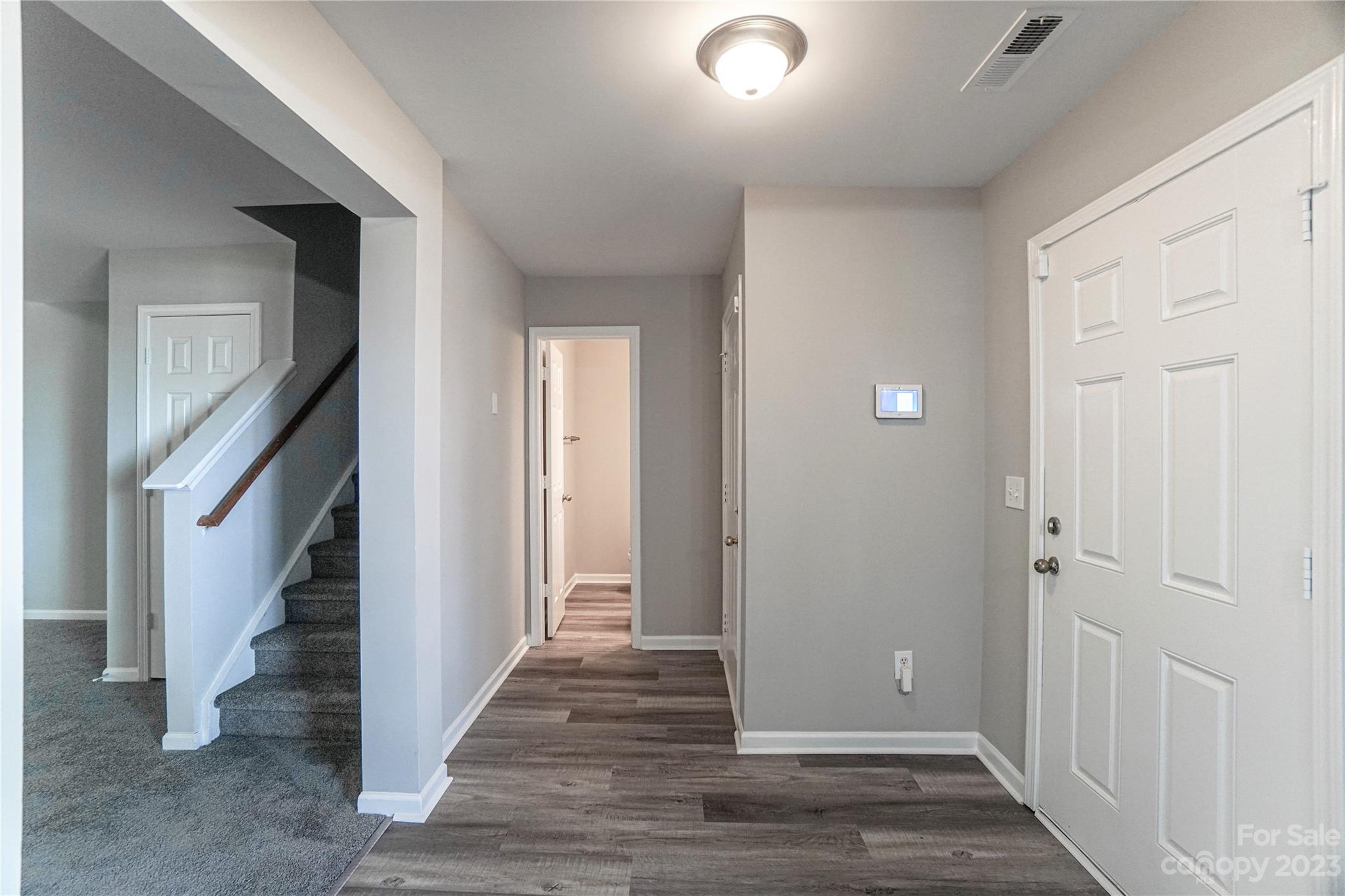 1312 Ben Livingston Road Charlotte, NC 28214 - Photo 10 of 12 a view of a hallway with wooden floor and entryway