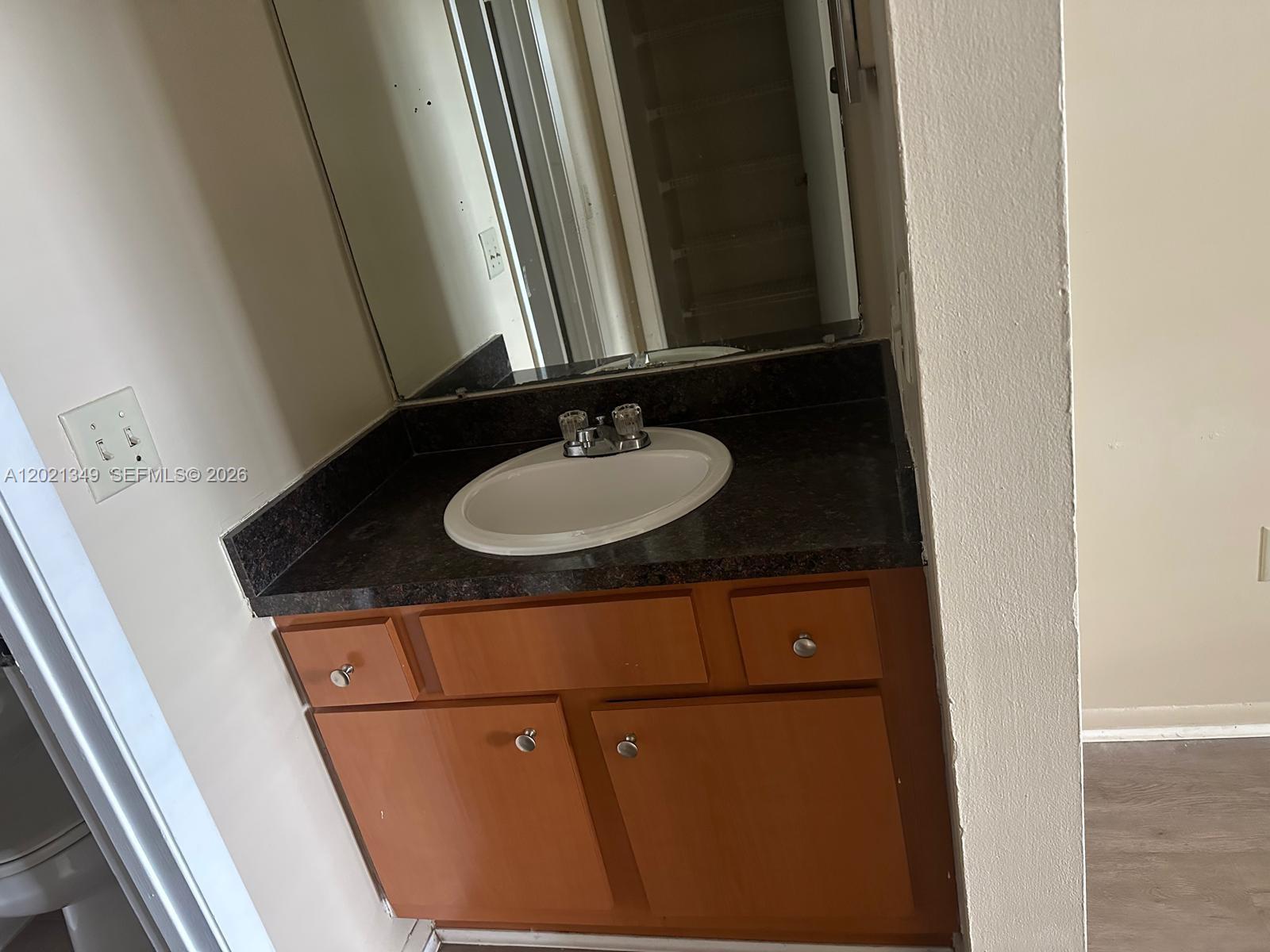 4481 West McNab Road, Unit 37 Pompano Beach, FL 33069 - Photo 13 of 20 a bathroom with a sink and a mirror