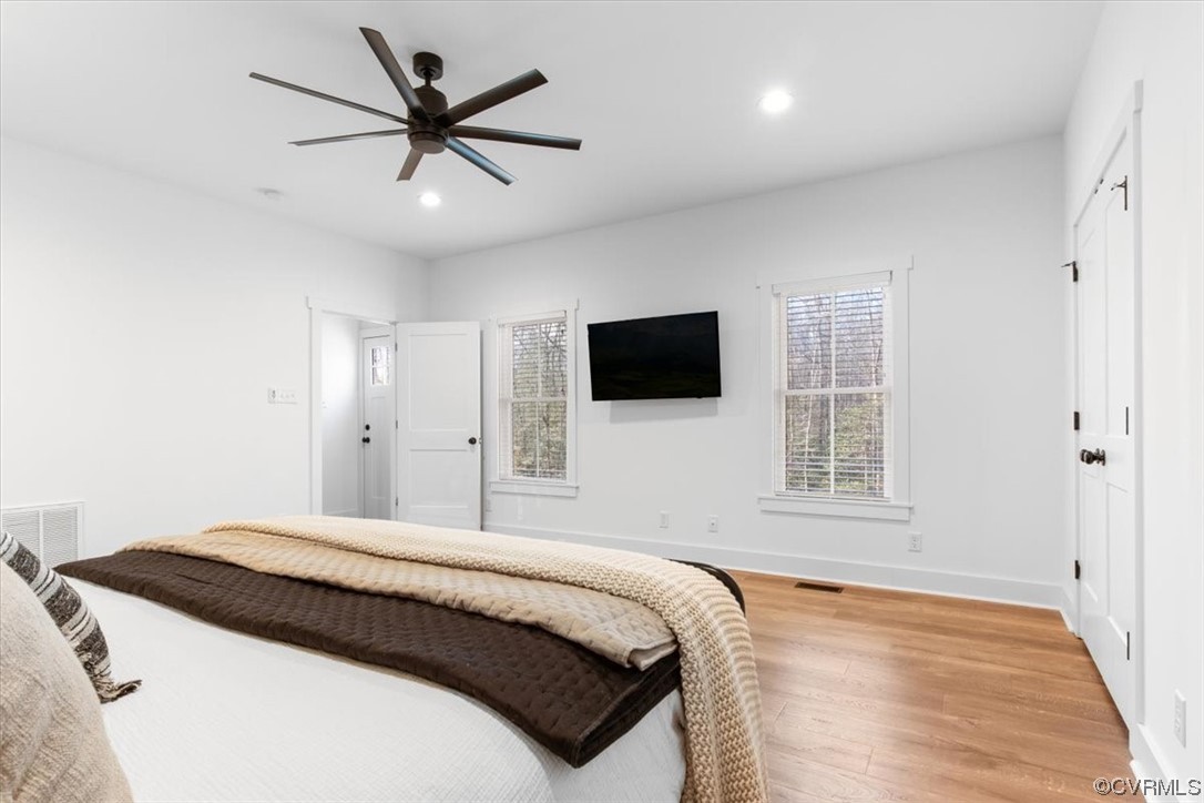 10100 Winterpock Road Chesterfield, VA 23832 - Photo 16 of 29 a bedroom with a large bed and a flat screen tv