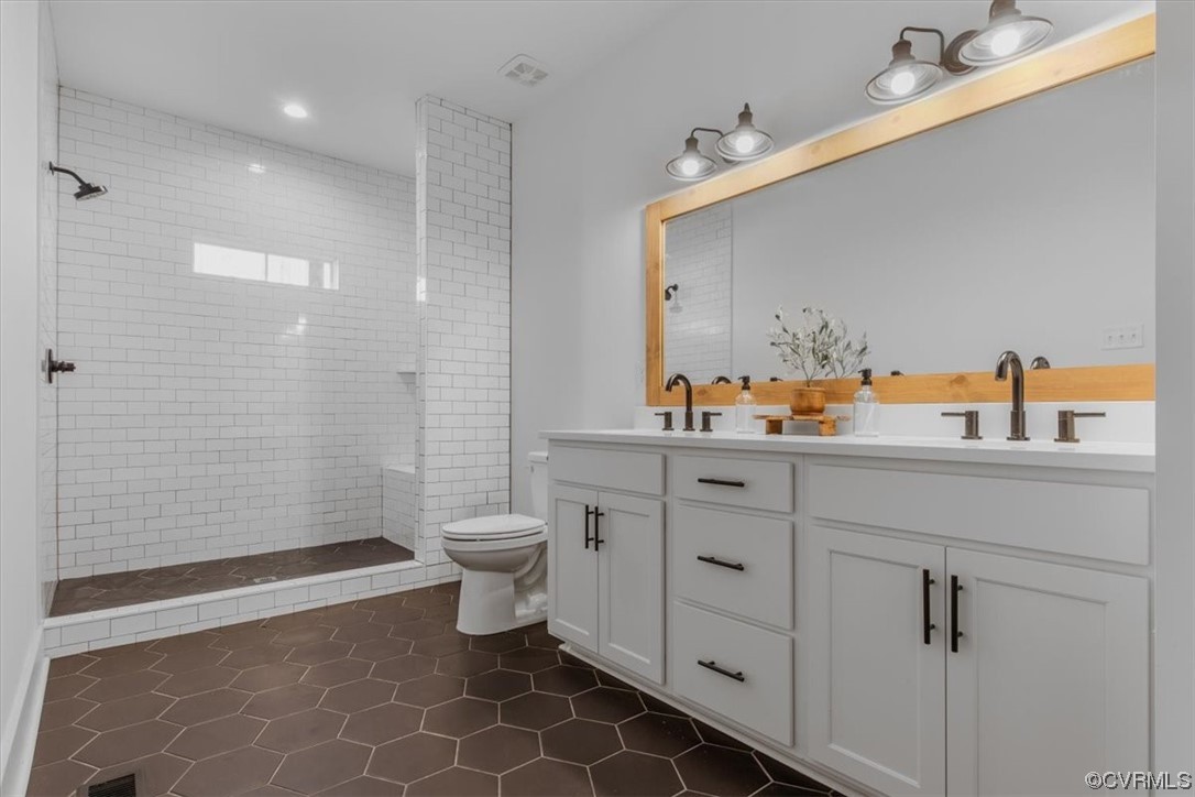 10100 Winterpock Road Chesterfield, VA 23832 - Photo 18 of 29 a bathroom with a sink a toilet and shower