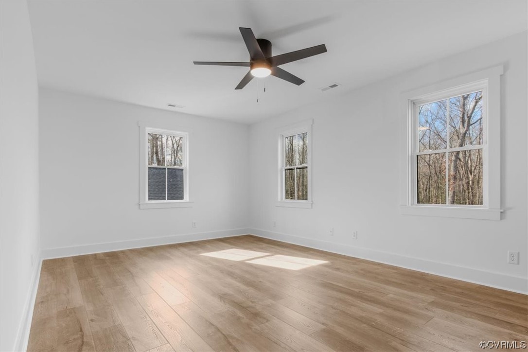 10100 Winterpock Road Chesterfield, VA 23832 - Photo 23 of 29 a view of empty room with wooden floor and fan