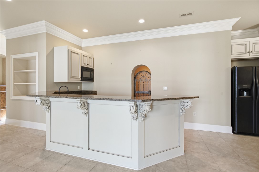 610 Highridge Drive Seneca, SC 29672 - Photo 41 of 50 This spacious lower level kitchen offers a large counter space and appliances for culinary endeavors.