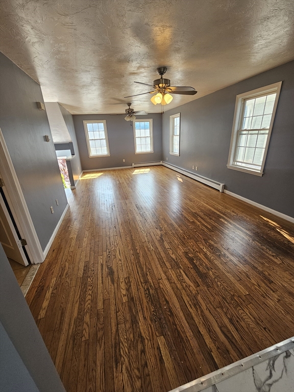 40 Merrick Street, Unit A Worcester, MA 01609 - Photo 7 of 32 wooden floor in an empty room with a window