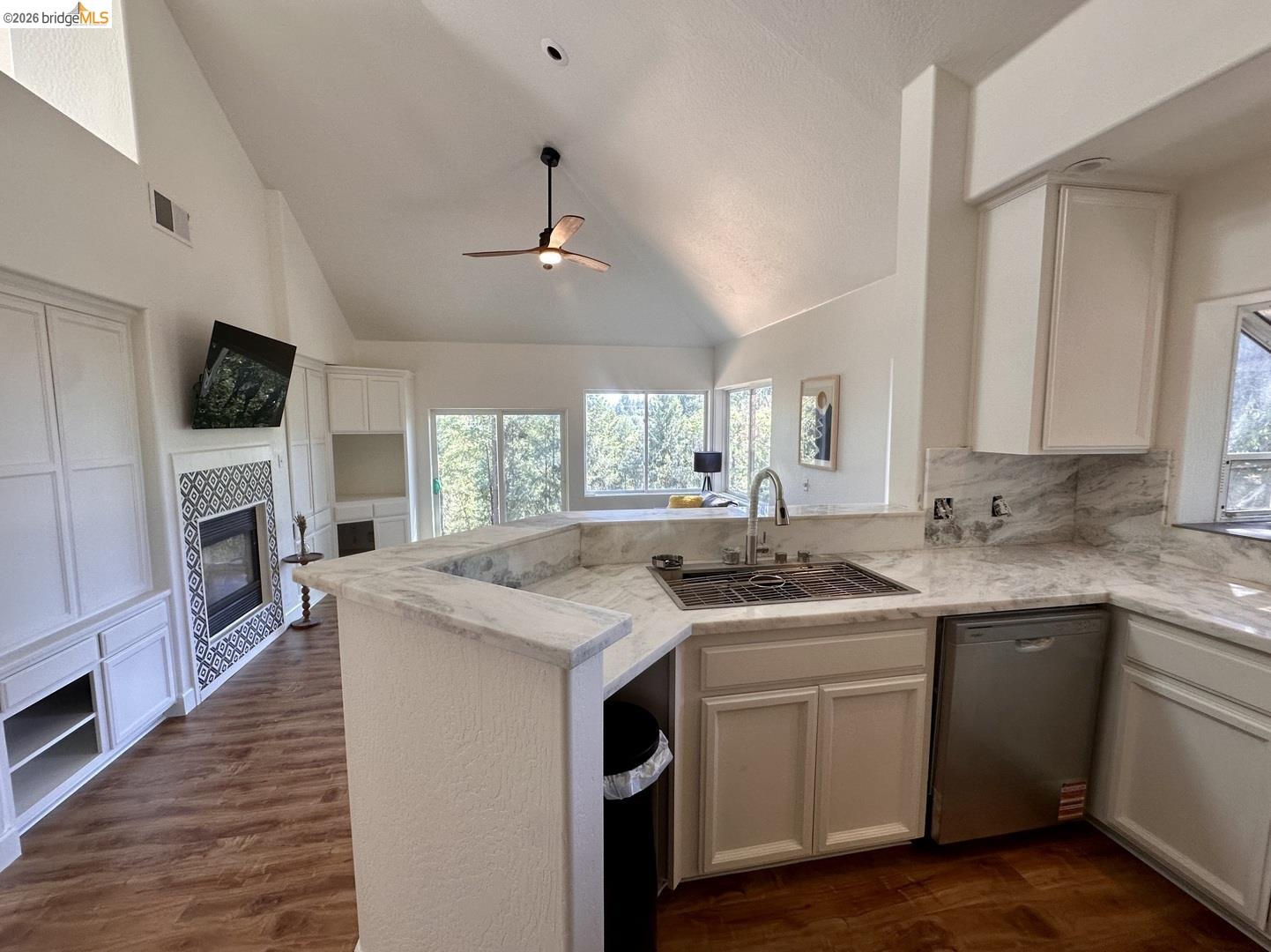 2080 Nelson Road Camino, CA 95709 - Photo 7 of 55 Kitchen featuring a stainless steel sink with a high-arc faucet, light-toned cabinetry, and extensive light-toned countertops