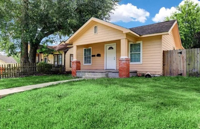 front view of a house with a yard