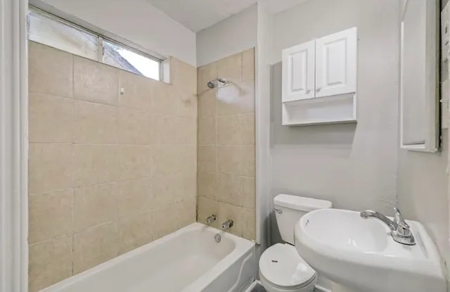 a bathroom with a toilet and a sink