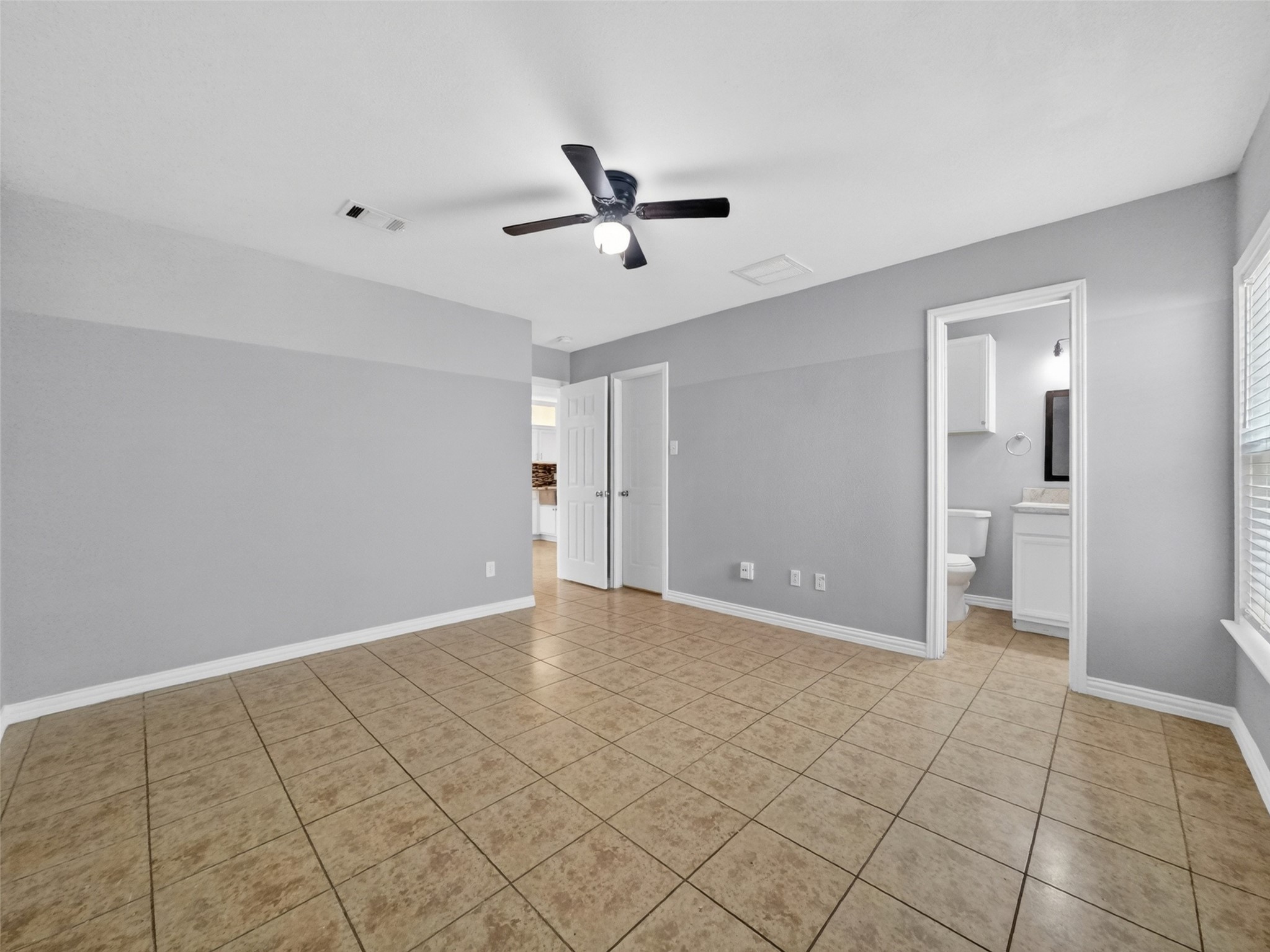 6231 Lone Prairie Way Katy, TX 77449 - Photo 17 of 27 Big enough for a reading nook or extra dresser, this primary bedroom is where calm lives.