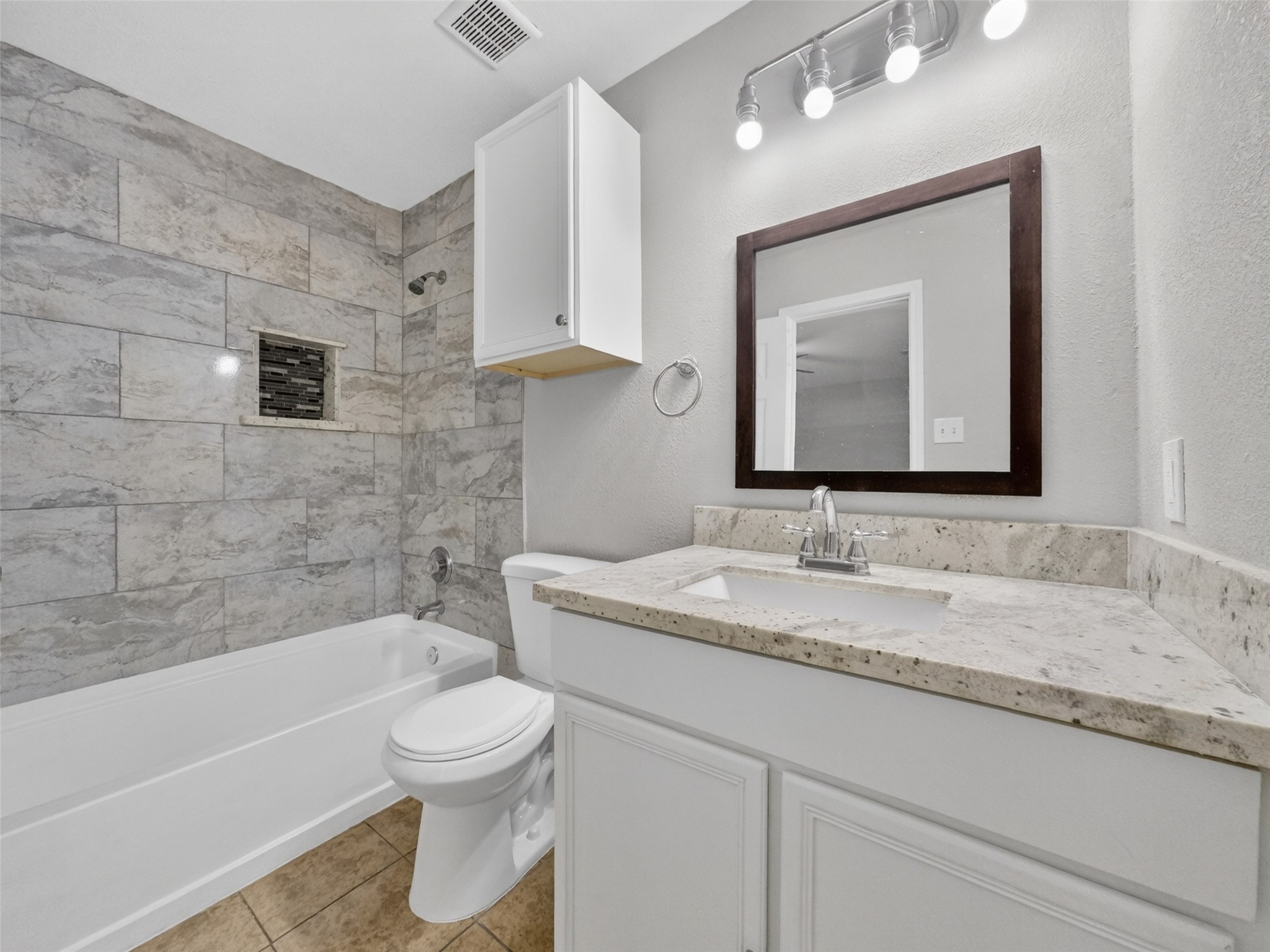 6231 Lone Prairie Way Katy, TX 77449 - Photo 18 of 27 Clean lines, beautiful tilework, and modern fixtures—your daily unwind starts right here.