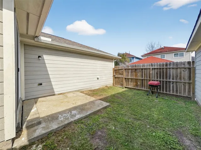 a view of a backyard with a garden and plants