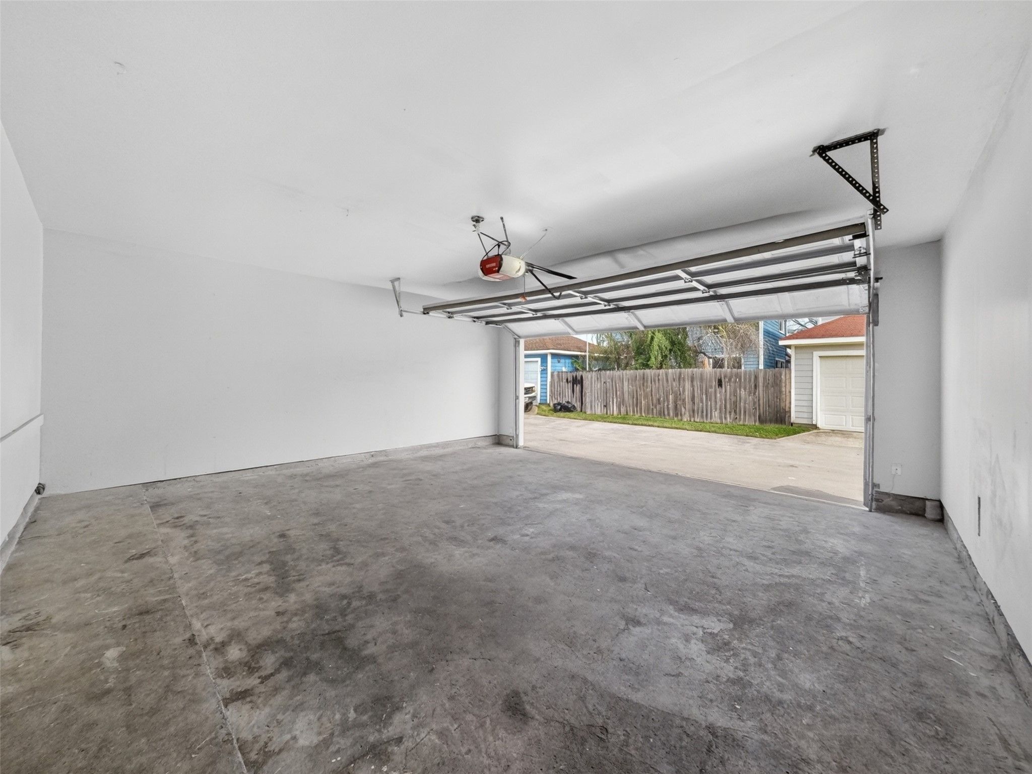 6231 Lone Prairie Way Katy, TX 77449 - Photo 25 of 27 Two-car garage with direct access means no more hauling groceries in the rain—plus extra storage for tools and gear.